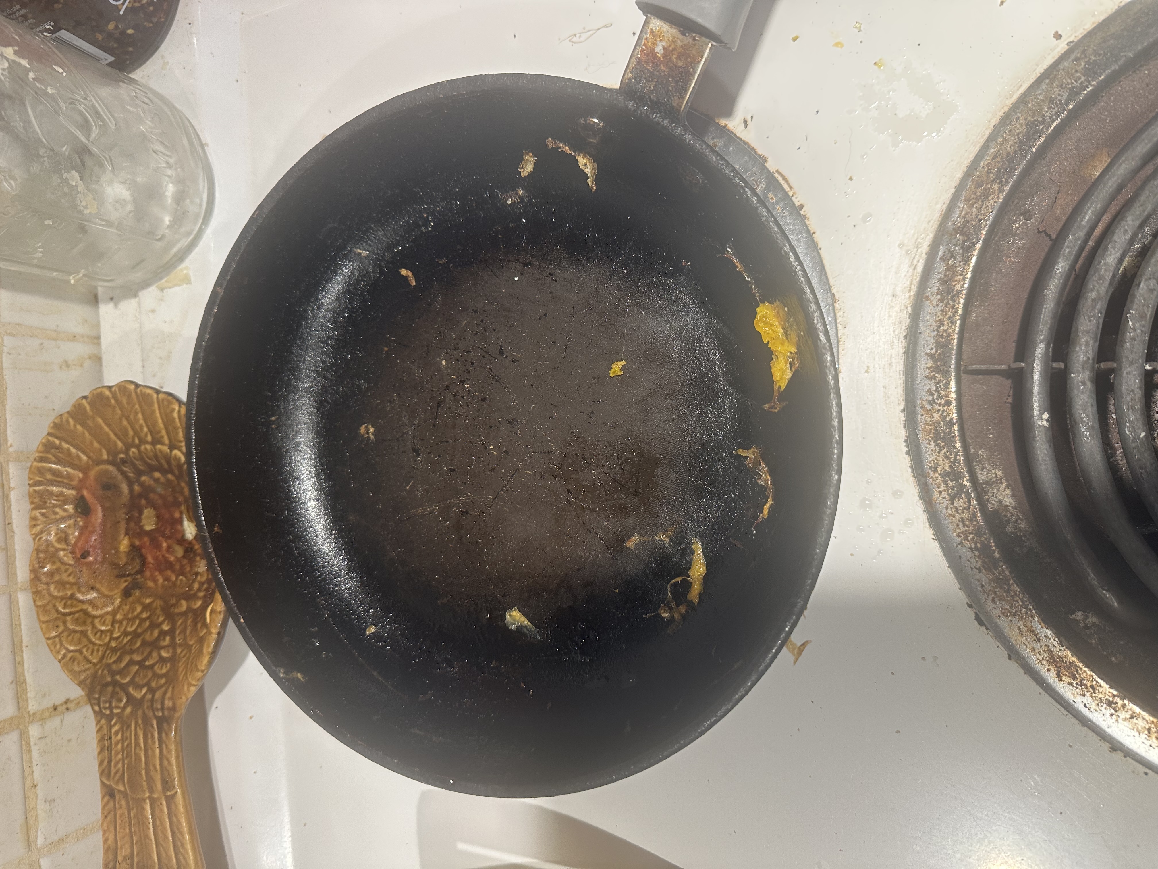 Nonstick pan with abandoned egg fragments