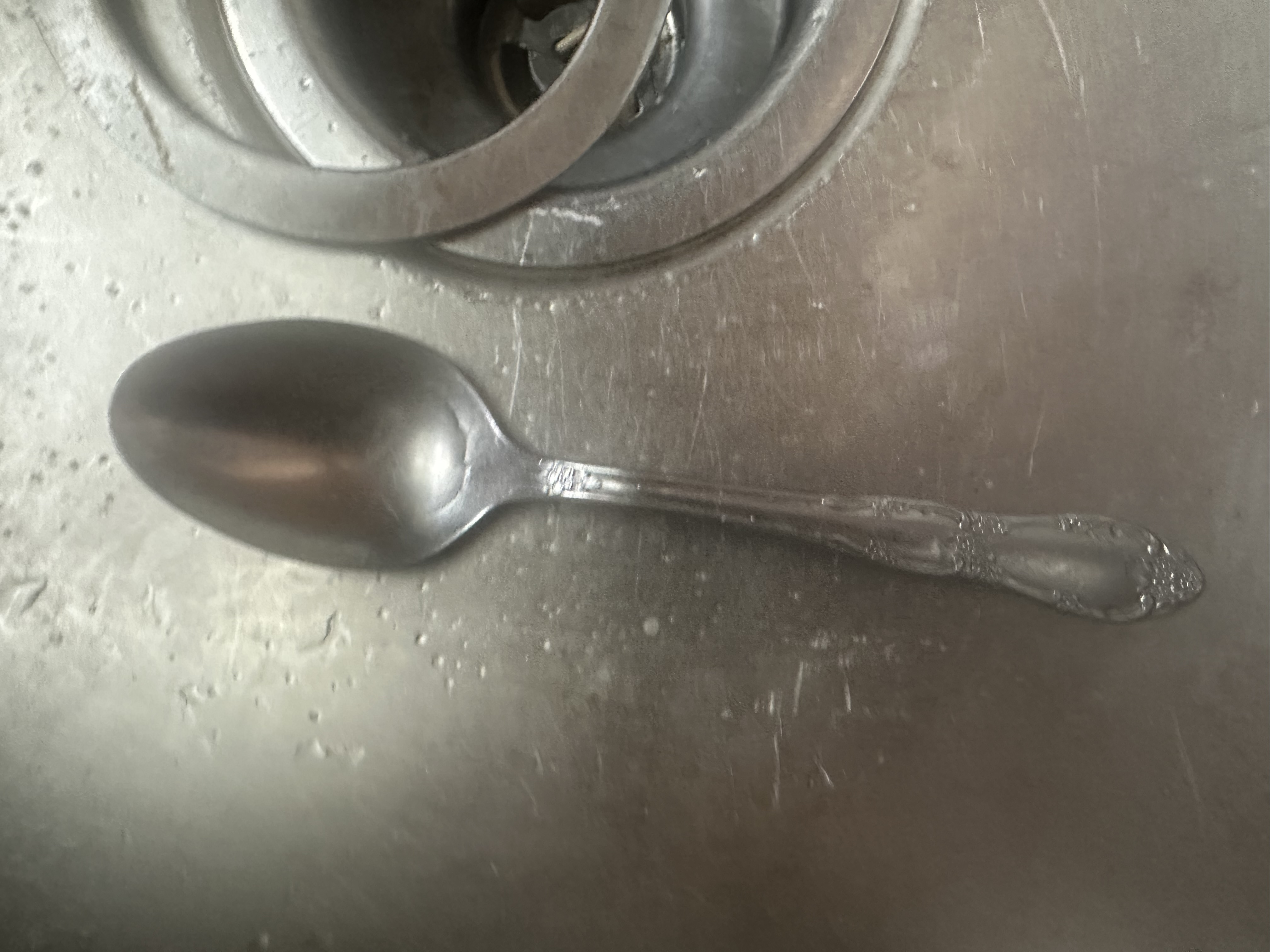 Spoon beside kitchen sink